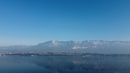 View over a lake. Blue sky and mountain.