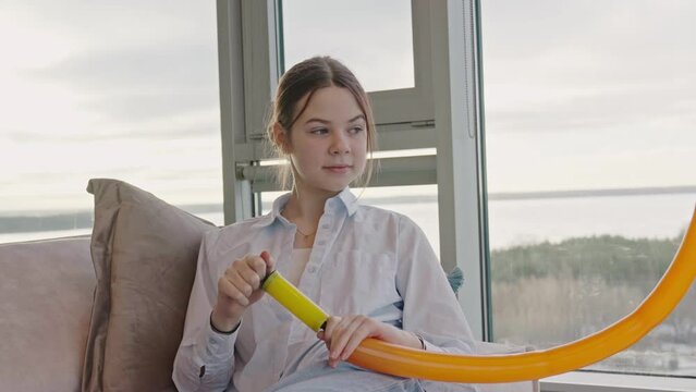 Children inflate modelling balloons. kids having fun with balloons at home