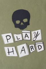 black paper skull glyph cutout and message 