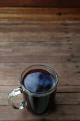 black coffee on a wooden table