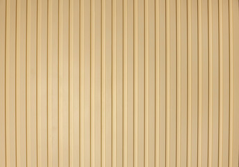 Ribbed wooden wall panels, background texture. Modern wall design with vertical wooden slats. - obrazy, fototapety, plakaty