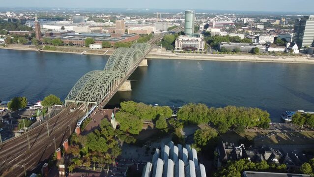 The K&ouml;lntriangle is a high tower in Cologne, Germany, located on the Rheinauhafen shot by drone over Rhine River with hohenzollern bridge in front