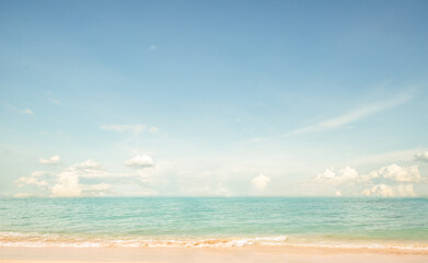 Obraz premium Seascape abstract beach background. calm sea and sky. Focus on sand foreground. vintage color tone.
