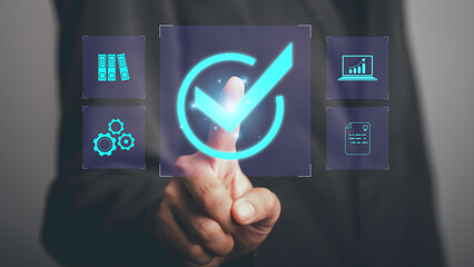 Quality assurance control certification standard   Businessman touch check mark  service guarantee excellence QC and improvement standardisation for business success.