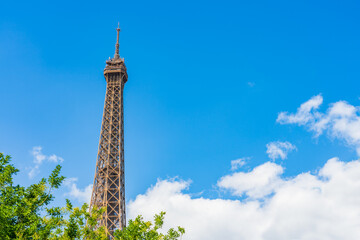 Obraz premium Top of Eiffel Tower seen from the park in Paris. France
