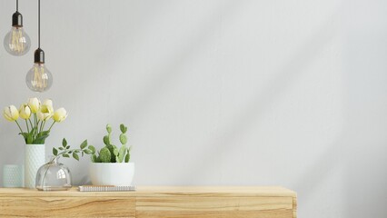 Wall mock up with flower vase,light blue color wall and wooden cabinet.