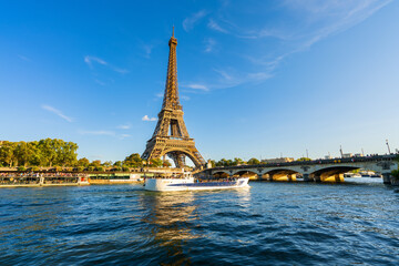 Fototapeta na wymiar Beautiful view of Eiffel Tower by Seine river in Paris. France