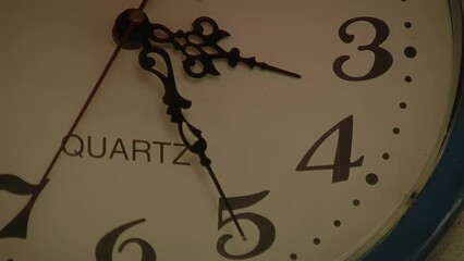An Old Quartz Clock Hung on a Wall Inside a Railway Station in Buenos Aires, Argentina. Close Up.