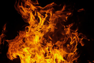 Obraz na płótnie Canvas Close up burning flames on black background for graphic design or wallpaper