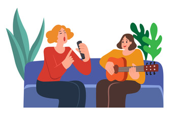 Two young women sit in the house and sing joyfully.
