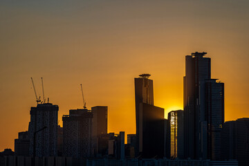 Fototapeta na wymiar Silhouettes of tall buildings in Yeouido, Seoul, South Korea taken at sunset time