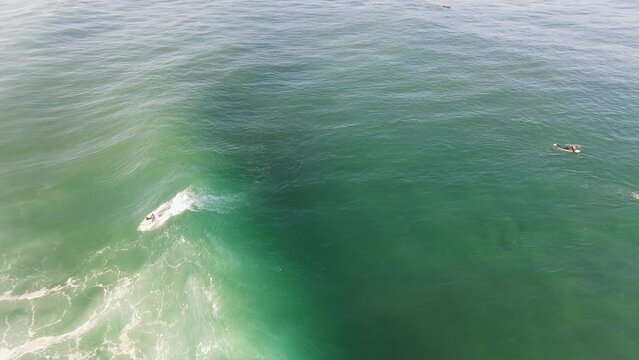 surfer surfing the wave hoosegow biarritz Basque Country lacanau ocean France nouvelle aquitaine gironde blue water French surf spot video footage drone aerial above view 4k sport powerful energy