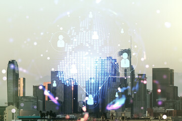 Virtual social network media hologram and world map on Los Angeles cityscape background. Double exposure