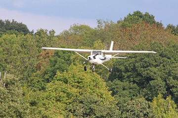 Fototapeta na wymiar Small private aeroplane, small white aircraft