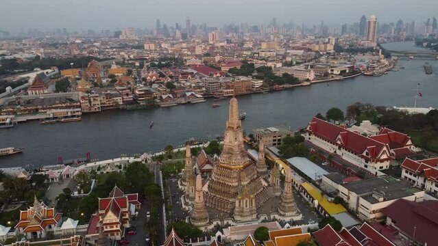 Aerial view of Wat Arun Buddhist temple located on the bank of Chao Phraya river in Bangkok, Thailand.