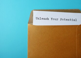 Office envelope opened with document written UNLEASH YOUR POTENTIAL, means realising your strengths within, identifying and letting skills, talents, capabilities lead to success