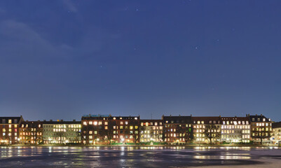 Fototapeta na wymiar House on the Embankment. Starry sky. Copenhagen, Denmark