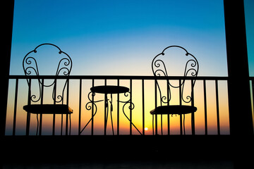 Very beautiful silhouette of chairs on the seashore of the sea