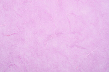 Fototapeta premium The texture of purple mulberry paper, for use as a background.