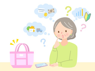 フリーマーケットで販売する商品を考えているミドル女性