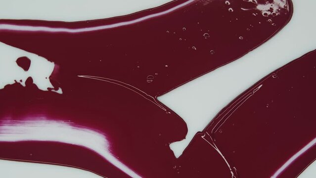 Magento. Red lipstick. Ink on white background. Smudge paint. Decorative cosmetics. Screensaver. Сreate abstract art. Watercolor, acrylic, oil, and pastel. Product related to makeup and cosmetics.