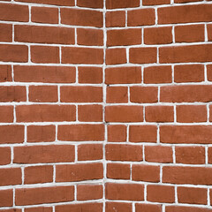 Minimal fragment of brick wall angle close up. Beautiful minimalist brick texture backdrop. Geometric and symmetrical background of brick wall pattern. Modern design of interior or exterior close-up.
