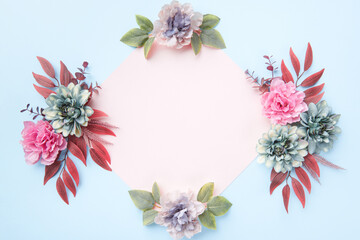 Happy Mother's Day, Women's Day, Valentine's Day or Birthday Pastel Colored Background. Floral flat lay greeting card template with beautiful silk flowers.