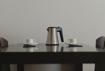 two white cups and a coffee pot on a black wooden table and two chairs