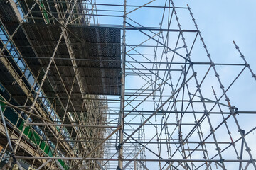 Maze of industrial construction scaffolding on building site