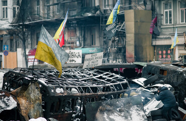 Revolution of Dignity in Ukraine. Burned bus on the barricades in Kyiv during Maidan revolution in...