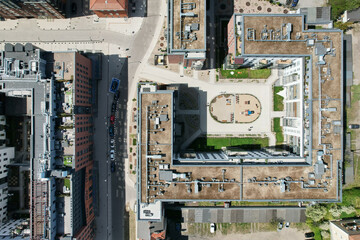 Fototapeta na wymiar A modern housing estate on the site of an old brewery in Gdańsk, shown with a drone from the air