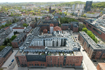 A modern housing estate on the site of an old brewery in Gdańsk, shown with a drone from the air © sebastiangora