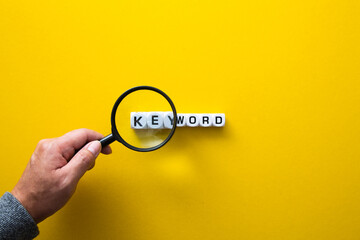 Block of Keyword on yellow background. Conceptual image of the importance of the keywords.