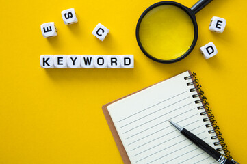 Block of Keyword on yellow background. Conceptual image of the importance of the keywords.