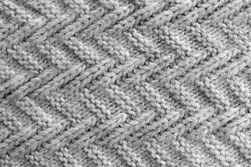 Abstract texture of a knitted bright surface with a pattern.