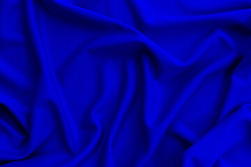 Bright thin knitted fabric with drapery, top view.	