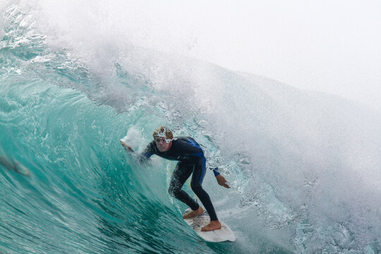 View of a surfer inside a tube or barreling wave. Fuerteventura, Canary Islands