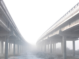Low angle view of merging highway in fog