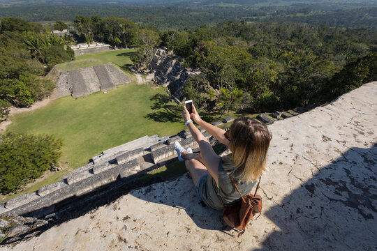 Woman taking picture on top of archaeological site