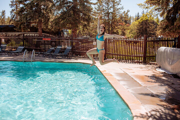 goofy girl jumping into pool