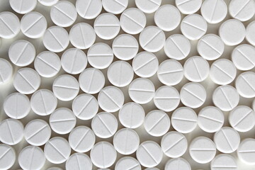 Abstract background of white pills on a white background.