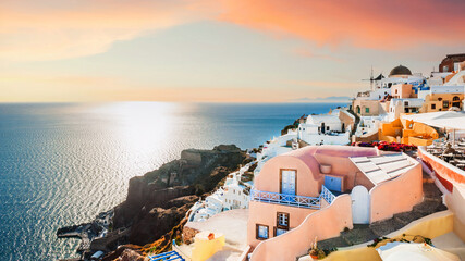 Beautiful sunset at Santorini island, Greece. White architecture with sea view
