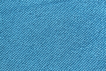 Naklejka na ściany i meble Abstract fabric texture in bright blue color.