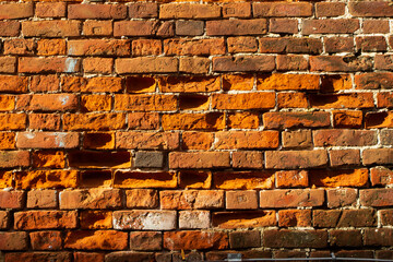 red brick wall with garland of light bulbs