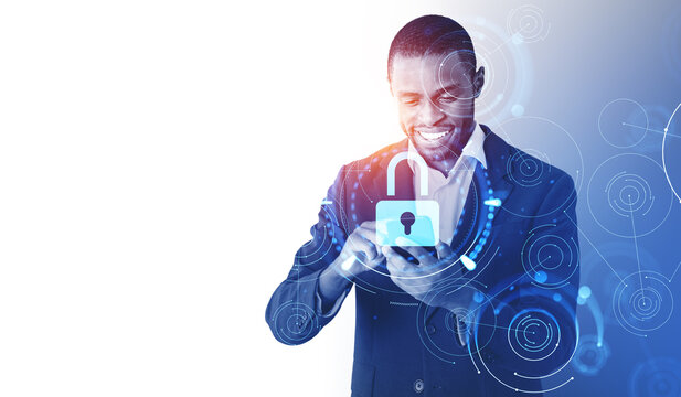 African American businessman in formal suit typing on smartphone