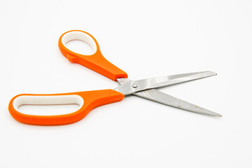 Scissors on the white background