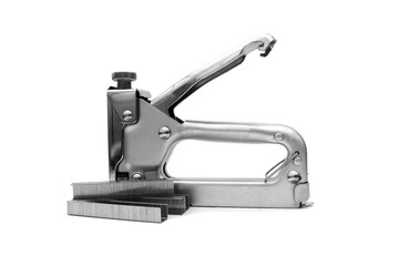 A construction stapler with staples lies on a white background.