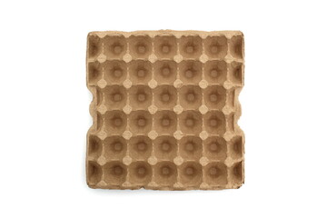 A large cardboard container for eggs lies on a white background.