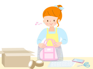 商品を包んで送るシニア女性若い女性