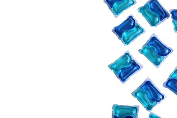 Abstract background of bright blue laundry capsules.